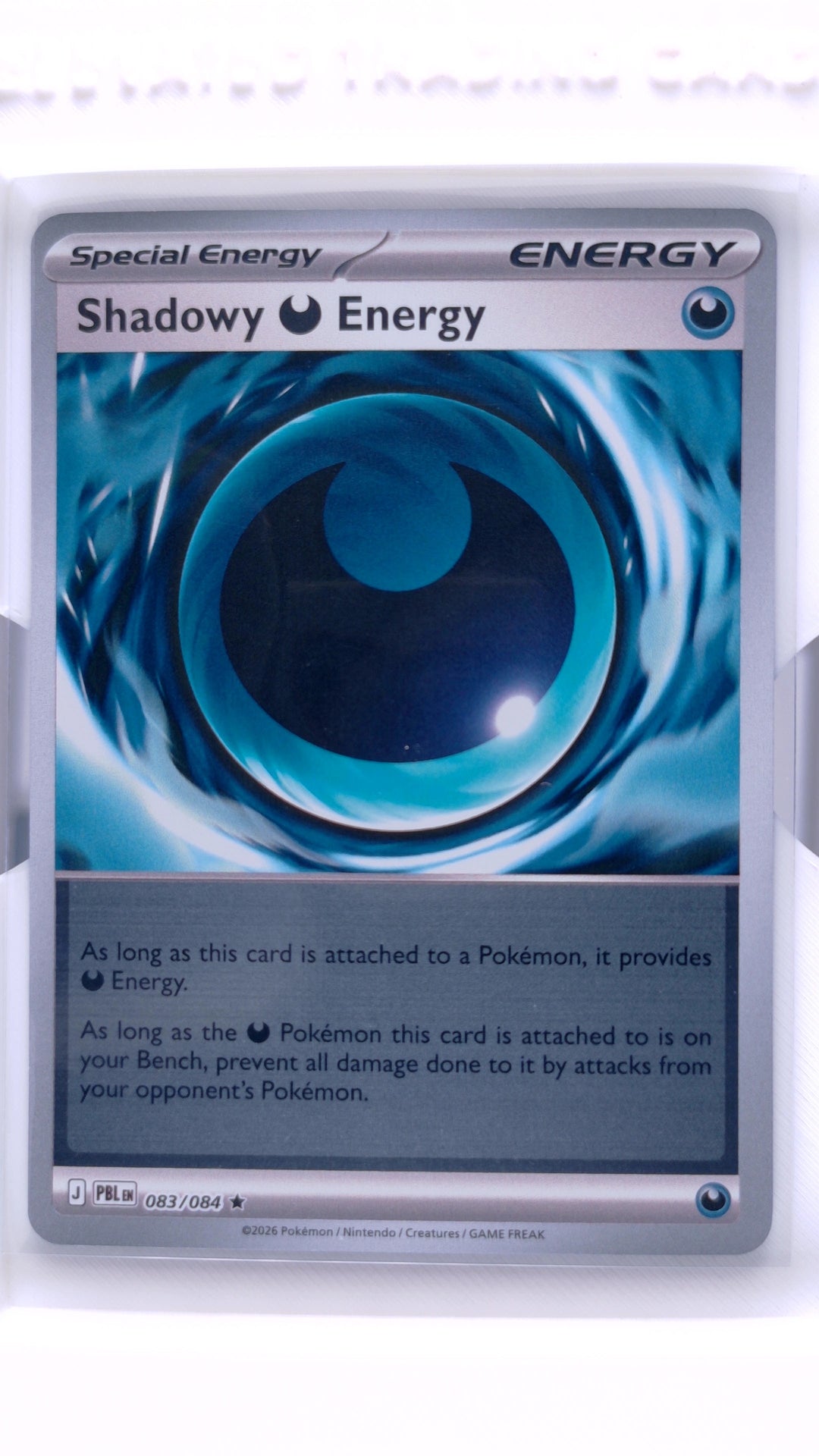 #83 Shadowy Darkness Energy Reverse Holo Rare - front